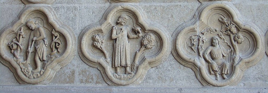 Three medallions carved in stone, featuring medieval ocupations.
