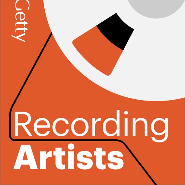 A graphic logo for the "Recording Artists" podcast by Getty. The design features a bold orange background with a partial illustration of a reel-to-reel tape recorder in the upper right corner, showing a white reel with black and orange segments. The title "Recording Artists" is written in large white text, with "Recording" in a thinner font and "Artists" in bold. The word "Getty" appears vertically on the left side in white text. A black line loops through the design, mimicking the path of audio tape, adding a dynamic element.