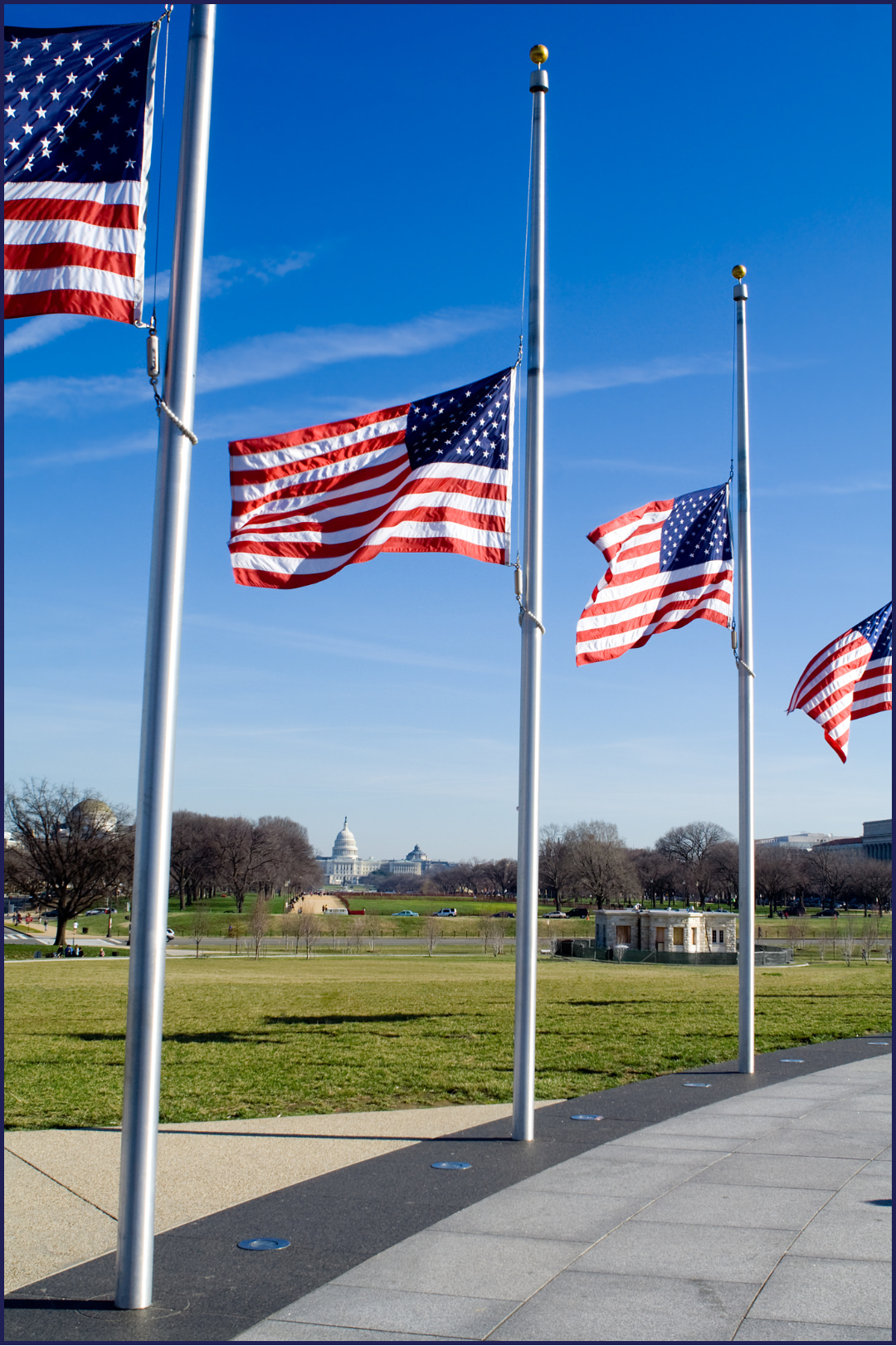 Half mast flags Three American flags fly at half mast